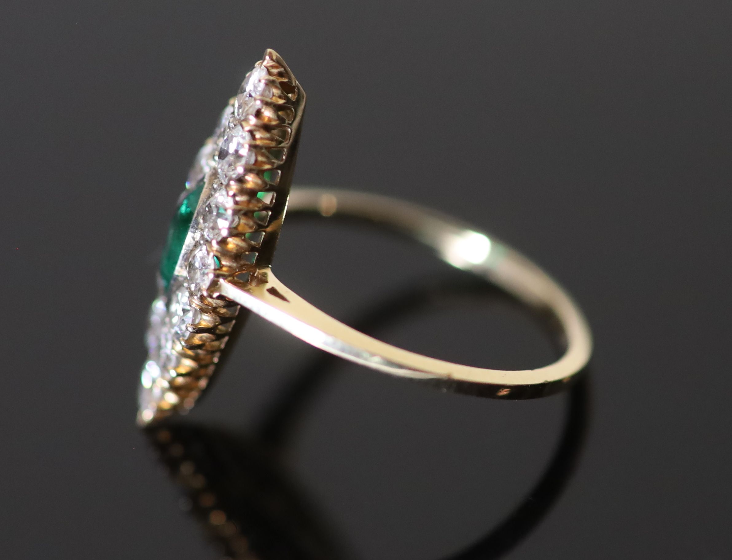 A Victorian style gold, emerald and diamond cluster set marquise shaped ring,